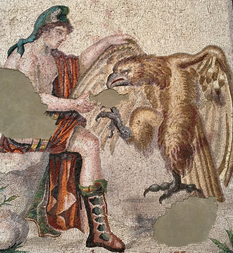 Mosaic of Ganymedes, seated, wearing a Phrygian cap, giving water to Zeus in the shape of an eagle.