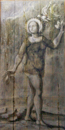 Black and white painting on wood depicting Clytie. The woman has the head covered by petals, roots are spreading from her feet and leaves from her hands since she transformed into a heliotrope/sunflower. Her head is facint the sun, on the top left corner.