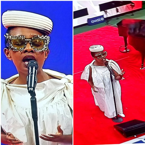 Cecile McLorin Savant wearing open collar flowing white dress with slit sleeves, multi-ringed round flat hat,  and large black glasses embellished with white stones.
