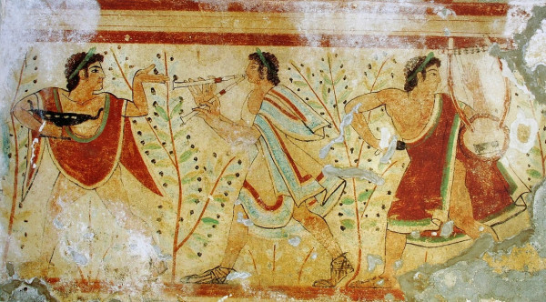 A panel from a tomb fresco showing three figured. One plays a double aulos, another appears to play a lyre, while the third seems to dance while holding a dish. Between the figures are young saplings.