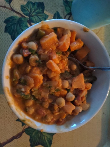 A bowl of Tunisian Sweet Potato Stew on a food tray
