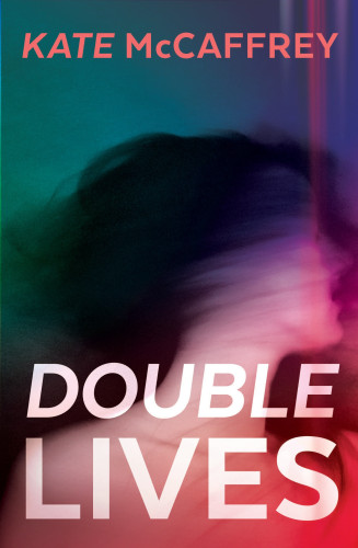 Image of the book cover for Double Lives by Kate McCaffrey - the image is mostly made up of a blurred out, dark haired woman's head and shoulders, turned to the right. She's bare-shouldered, and you can't make out any of her features. The cover is mostly translucent green in colour, with the area around her tending slightly towards read. The author's name is at the top of the cover, with the name of the book in large white letters at the bottom.