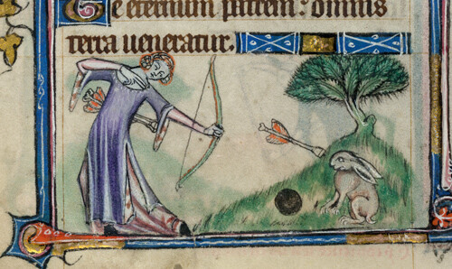 A woman with bow and arrow shooting towards a defiant rabbit, which is sitting on a bank staring straight at her and not making any move towards the rabbit-hole one hop away. The arrow has a curiously blunt end, like a toy arrow with a sucker. 